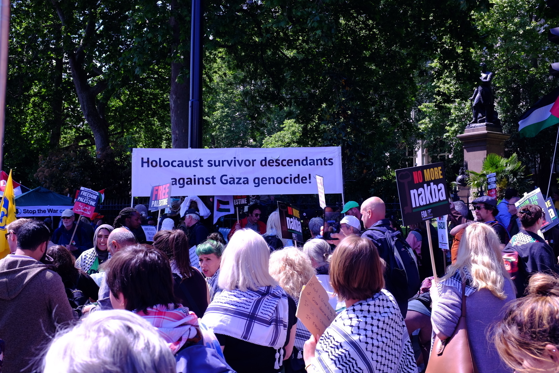 On the demonstration large sign reads 'Holocaust survivor descendants against Gaza genocide!' 